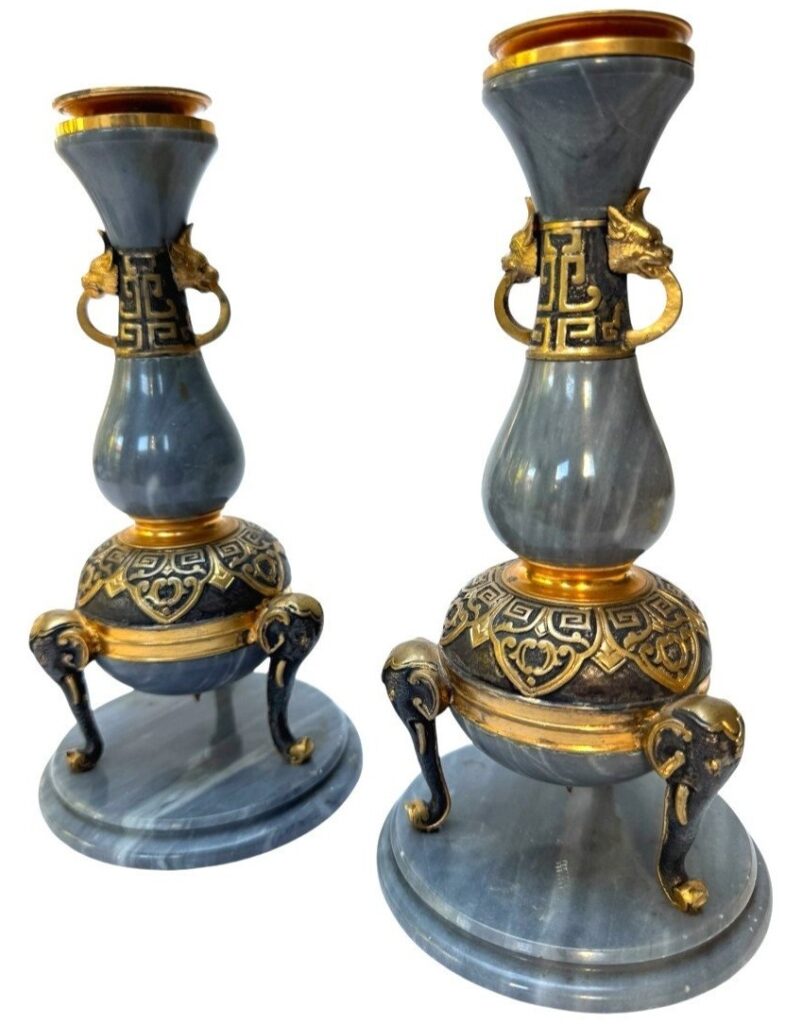 A pair of Orientalist candlesticks in Turquin Blue marble by Barbedienne.