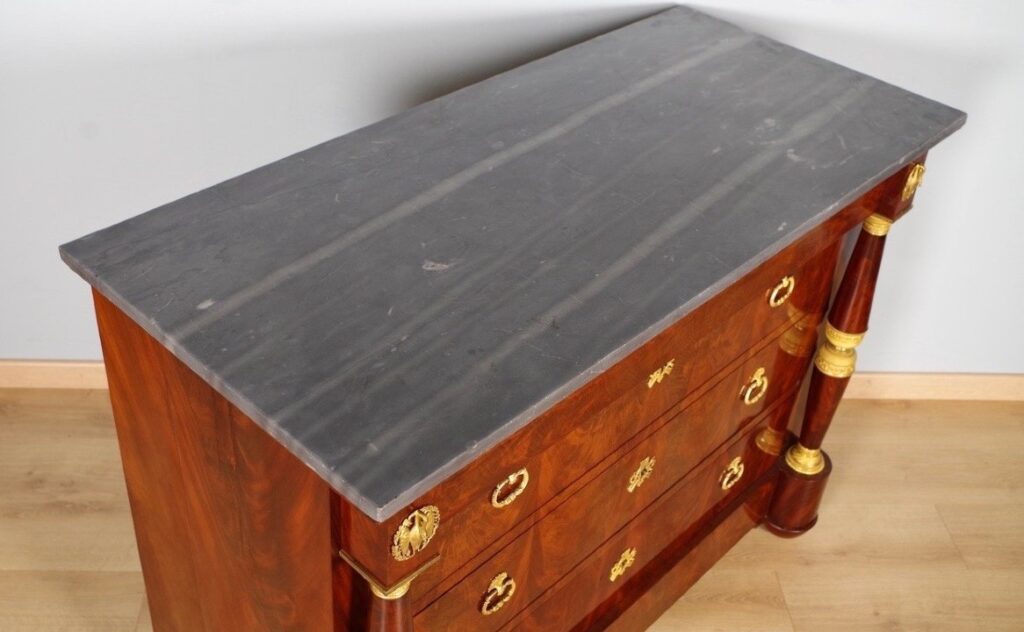 Turquin Blue marble top on an Empire period chest of drawers in mahogany.
