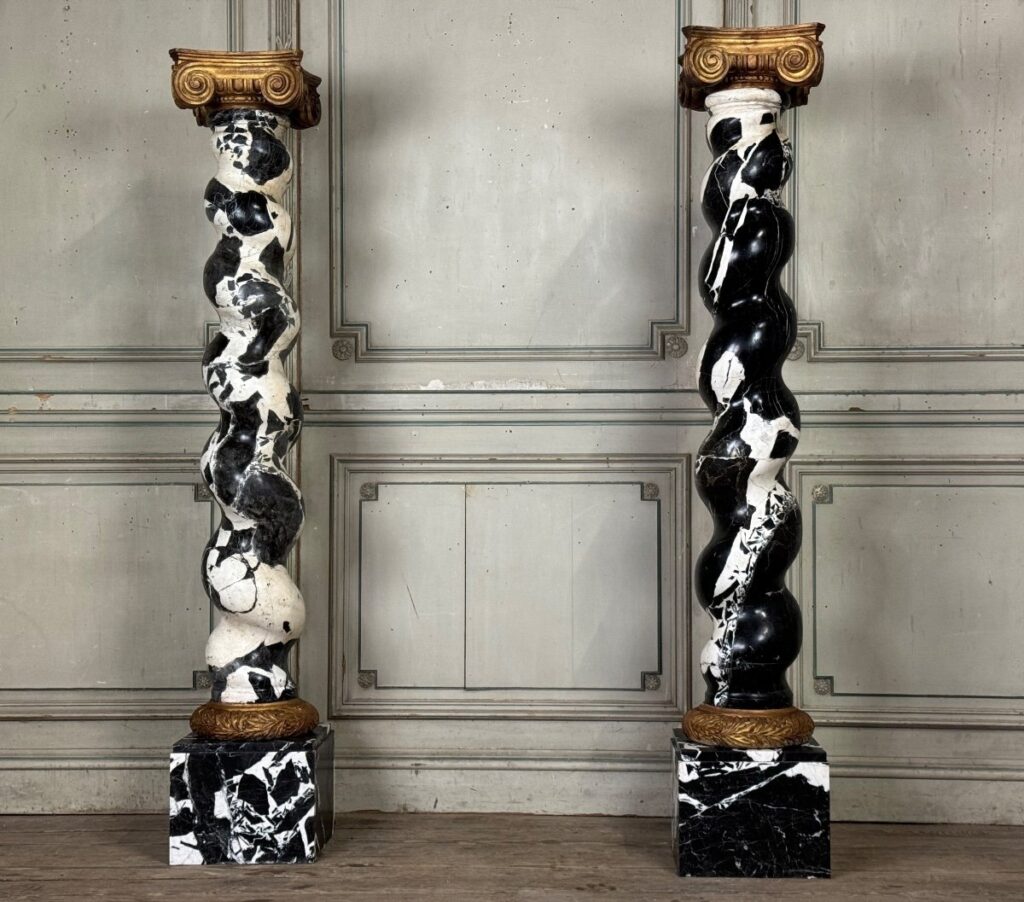 A pair of 19th-century solomonic columns in Grand Antique marble.