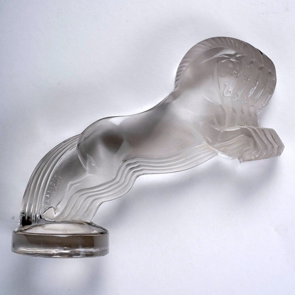 When Citroën ordered a mascot for their 5CV, playing with the car's name, Lalique created 5 stacked horses.