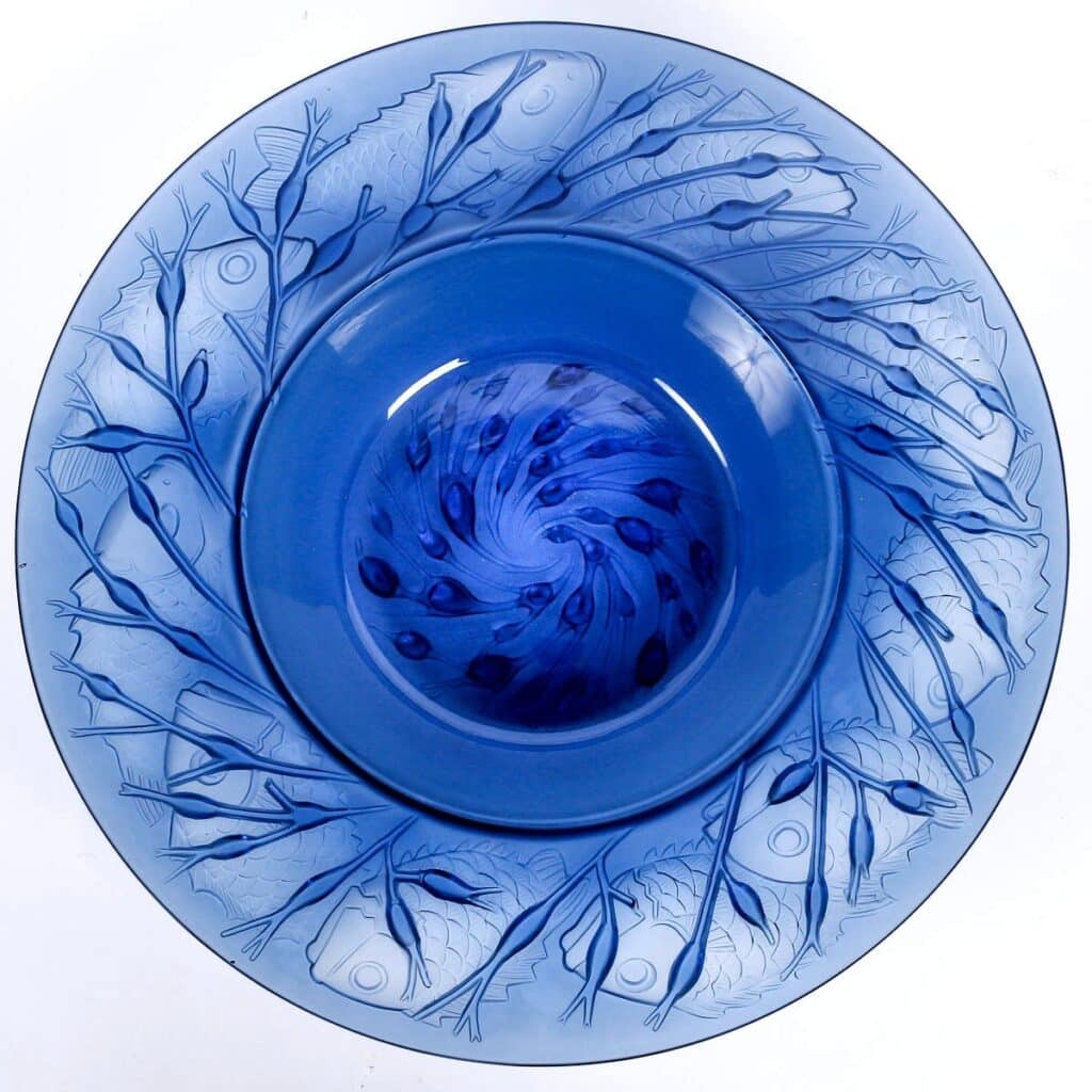 Fish and seaweed on this 1930 Lalique Anvers bowl in sapphire blue.