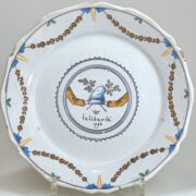 A Phrygian cap held by two hands symbolize liberty and the unity of those defending it. A Nevers revolutionary plate dated 1790.