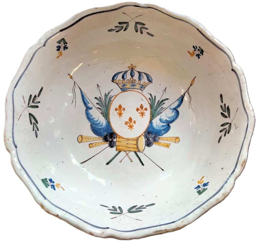 A pre-Revolution Nevers salad bowl with a flag decor inspired by Moustiers faience.