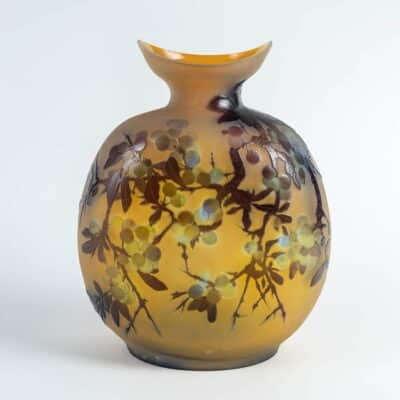 Rare flask by émile gallé with a decor of blackthorn berries and fruits, in triple-layered glass, acid-etched in cameo relief on an opalescent yellow background.
