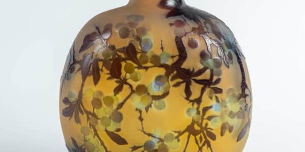 Rare flask by émile gallé with a decor of blackthorn berries and fruits, in triple-layered glass, acid-etched in cameo relief on an opalescent yellow background.