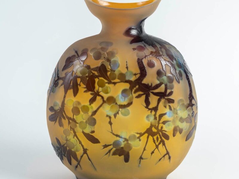 Rare flask by émile gallé with a decor of blackthorn berries and fruits, in triple-layered glass, acid-etched in cameo relief on an opalescent yellow background.