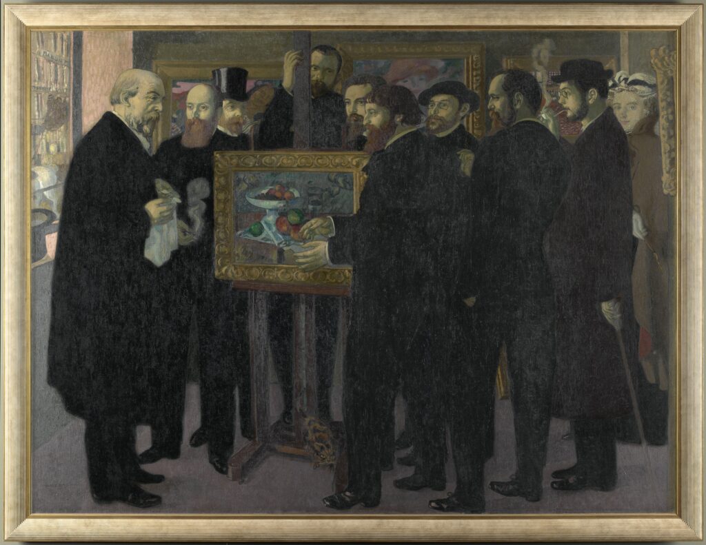 Homage to Cézanne, a painting by Maurice Denis in 1900. It takes place in Ambroise Vollard's gallery. Vollard is behind the easel of Cézanne's painting. Many Nabi painters are present: Paul Sérusier is talking to Odilon Redon. Are also found: Edouard Vuillard, Maurice Denis, Paul Ranson, Ker-Xavier Roussel, Pierre Bonnard.