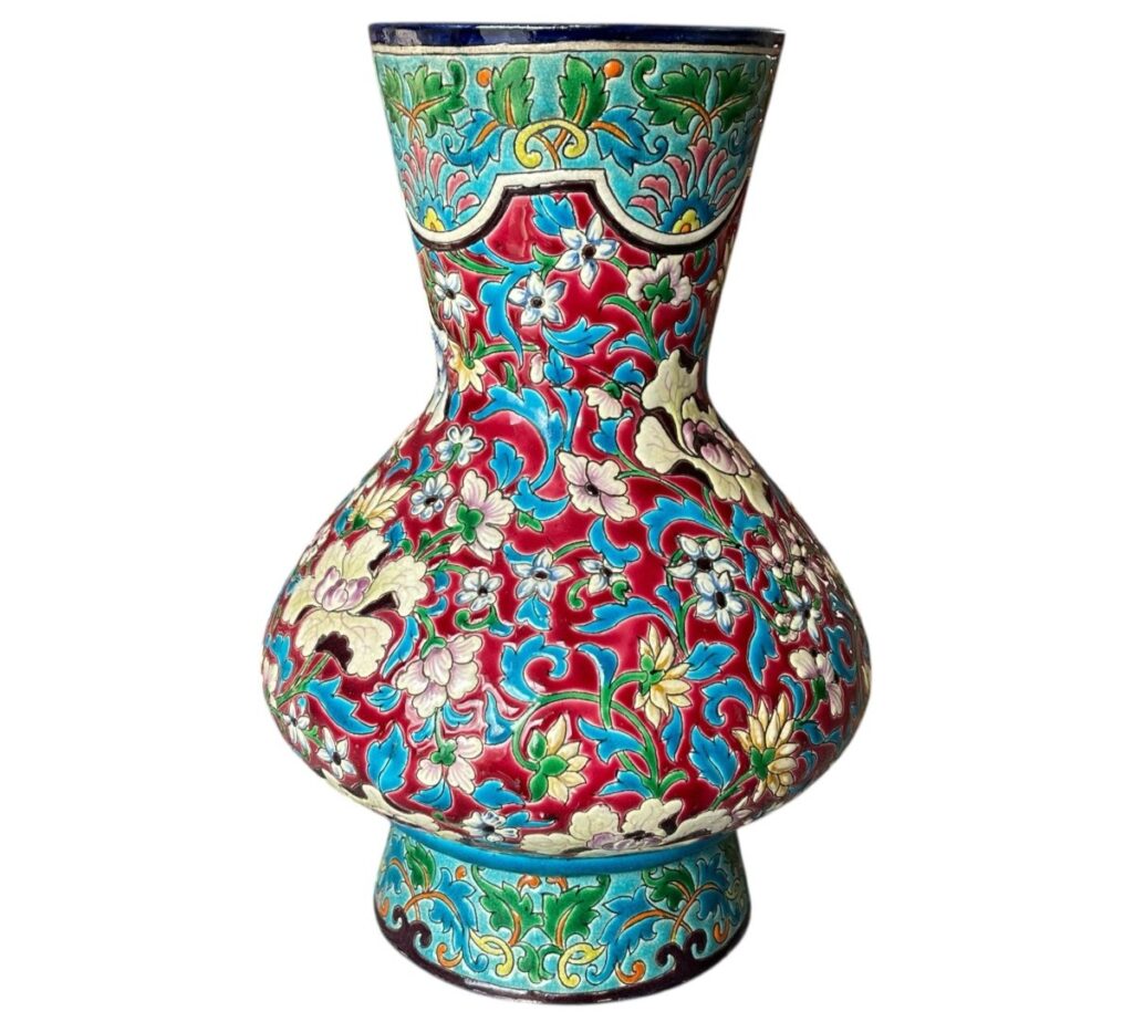 The influence of Chinese decorative arts is obvious in this Longwy baluster vase. The D792 decor shows chrysanthemums or peonies in a lively color palette reminiscent of Chinese cloisonné enamels.
