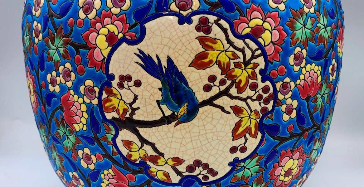 A striking 19th-century Longwy planter with a D5670 decor and a blue jay.