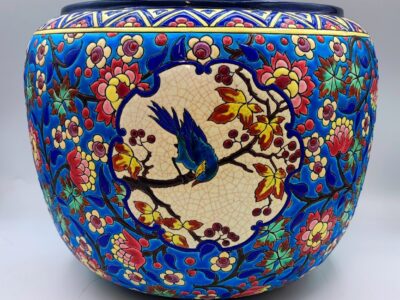 A striking 19th-century Longwy planter with a D5670 decor and a blue jay.