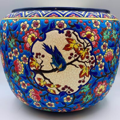 A striking 19th-century Longwy planter with a D5670 decor and a blue jay.