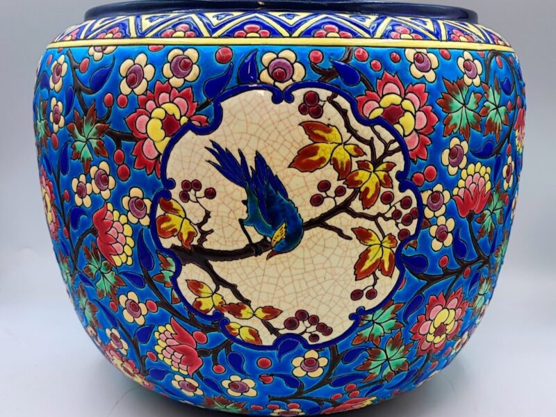 A striking 19th-century Longwy planter with a D5670 decor and a blue jay.