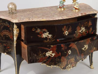 An 18th-century chest of drawers with polychrome European lacquer decoration, in blue, red, and gold on a black background. Typical of Mathieu Criaerd for the lacquer, the rich gilt bronze decoration, the trim and apron.