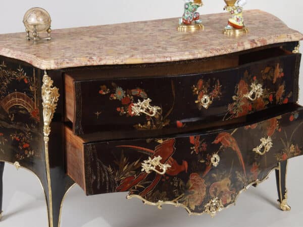 An 18th-century chest of drawers with polychrome European lacquer decoration, in blue, red, and gold on a black background. Typical of Mathieu Criaerd for the lacquer, the rich gilt bronze decoration, the trim and apron.