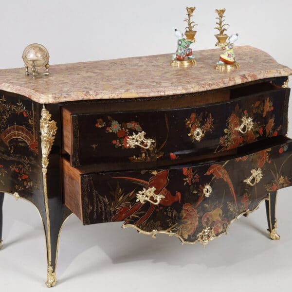 An 18th-century chest of drawers with polychrome European lacquer decoration, in blue, red, and gold on a black background. Typical of Mathieu Criaerd for the lacquer, the rich gilt bronze decoration, the trim and apron.