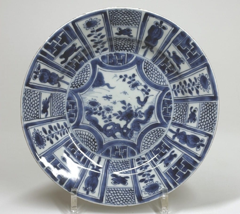 Prominent geometric patterns on this 17th-century Kraak porcelain plate (circa 1660). The center is emphasized by its star shape.