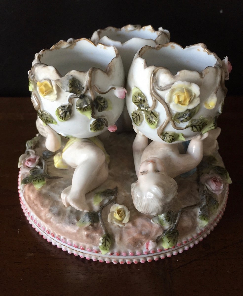 Egg Cups Forming A Group Of Porcelain Cherubs