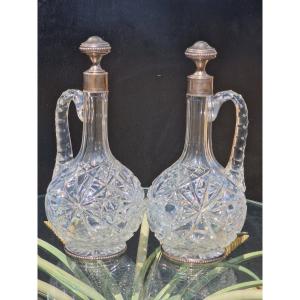 Pair Of Baccarat Crystal Ewers With Solid Silver Bases; Minerve-style Wine And Water Carafes