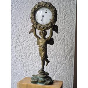 Porte montre à coq en bronze époque empire décor d'angelot aux ailes de papillon