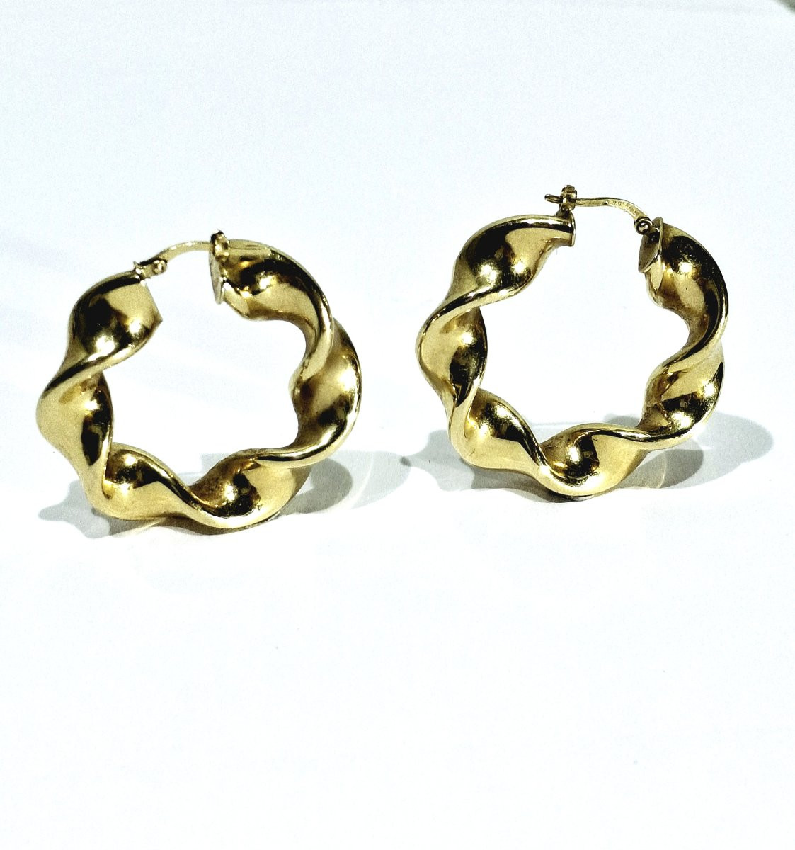 Pair Of Twisted Gold Hoop Earrings-photo-2