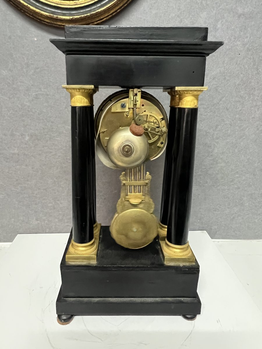 Empire Clock With 4 Columns, Pendulum, In Blackened Wood With Mercury-gilt Bronzes.-photo-8