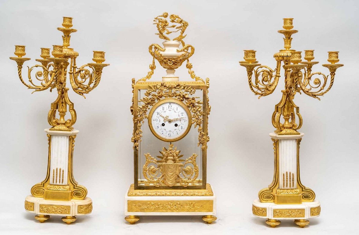 19th Century Garniture Comprising A Clock And A Pair Of Candelabra.