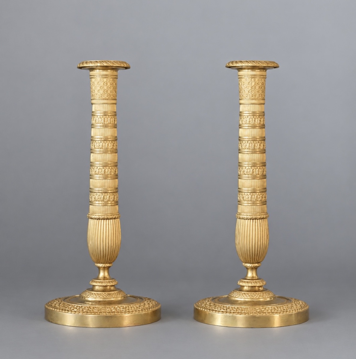 A Pair Of Empire Gilt-bronze Candlesticks. Early 19th Century. 