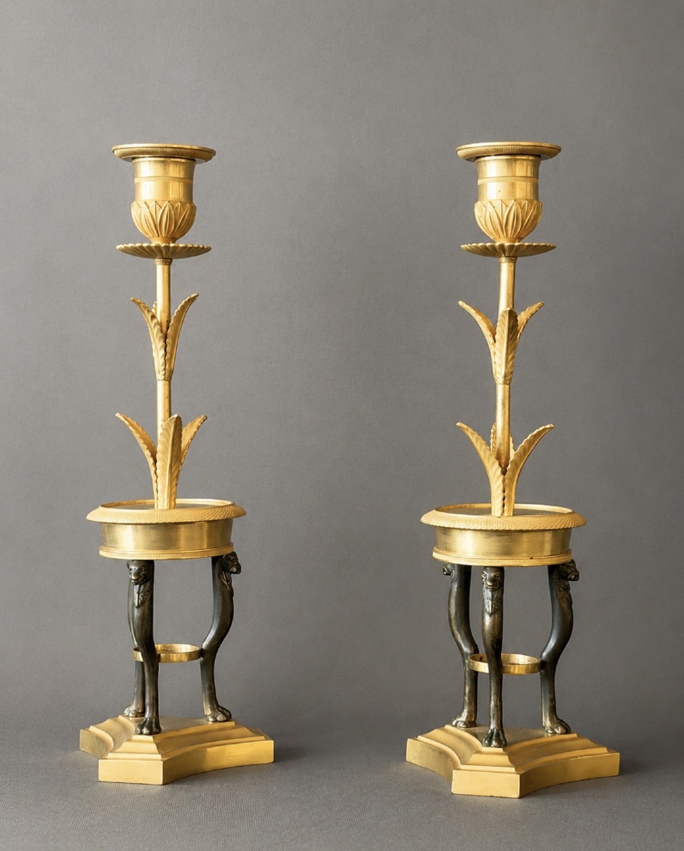 A Pair Of Consulat Gilt And Patinated Bronze Candlesticks. Circa 1800