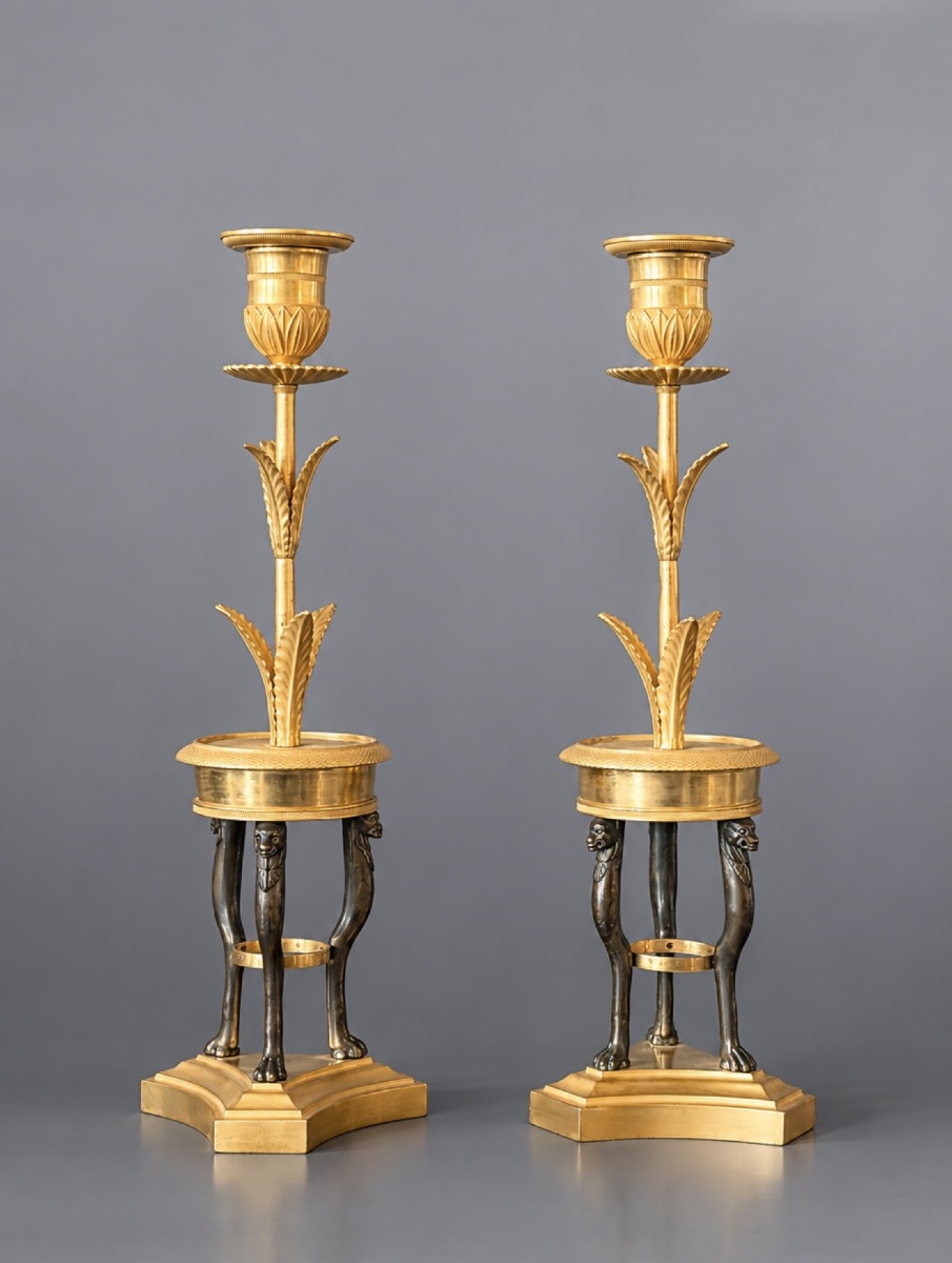 A Pair Of Consulat Gilt And Patinated Bronze Candlesticks. Circa 1800