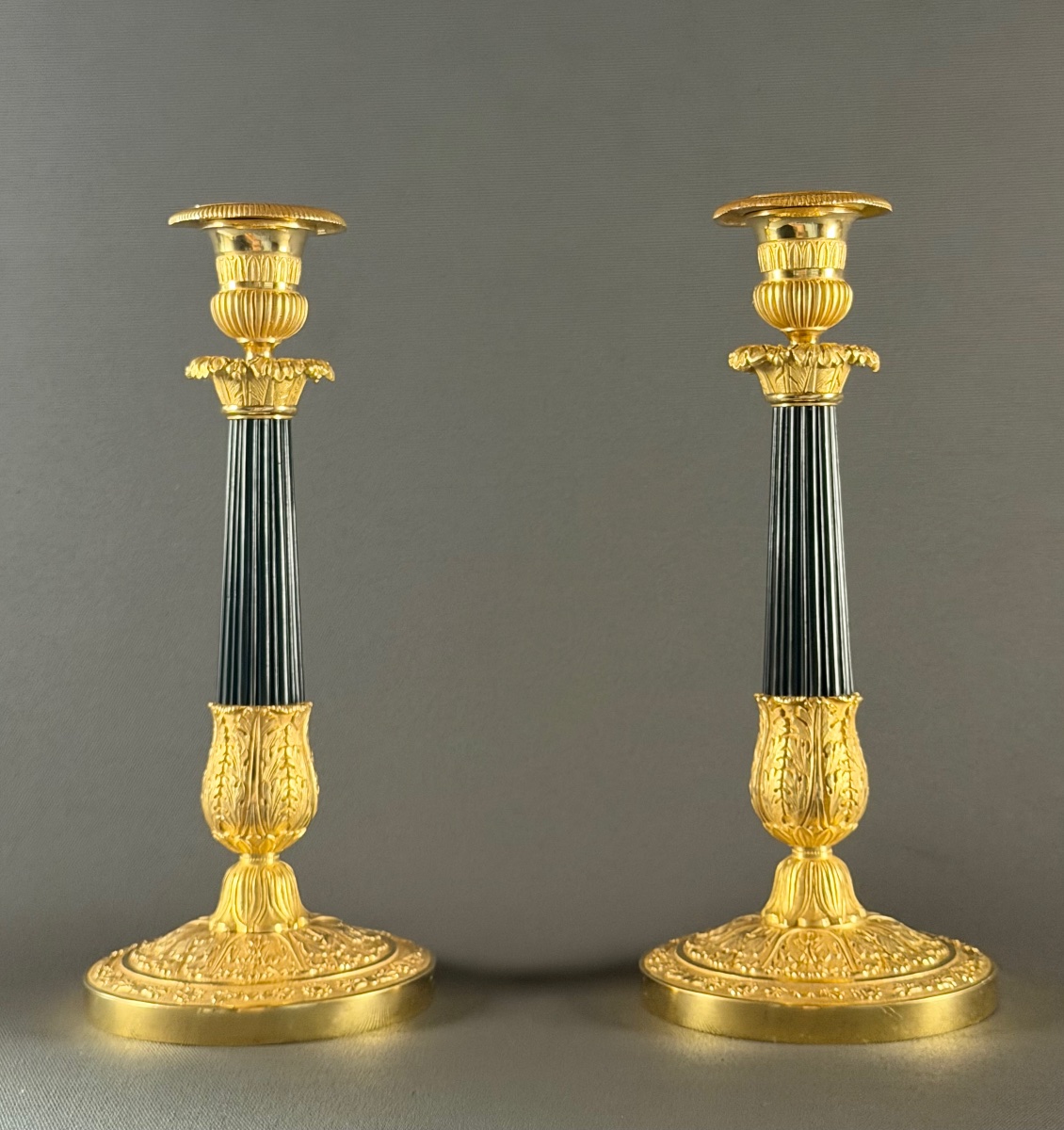 A Pair Of French Restoration Gilt And Patinated Bronze Candlesticks, Circa 1830.