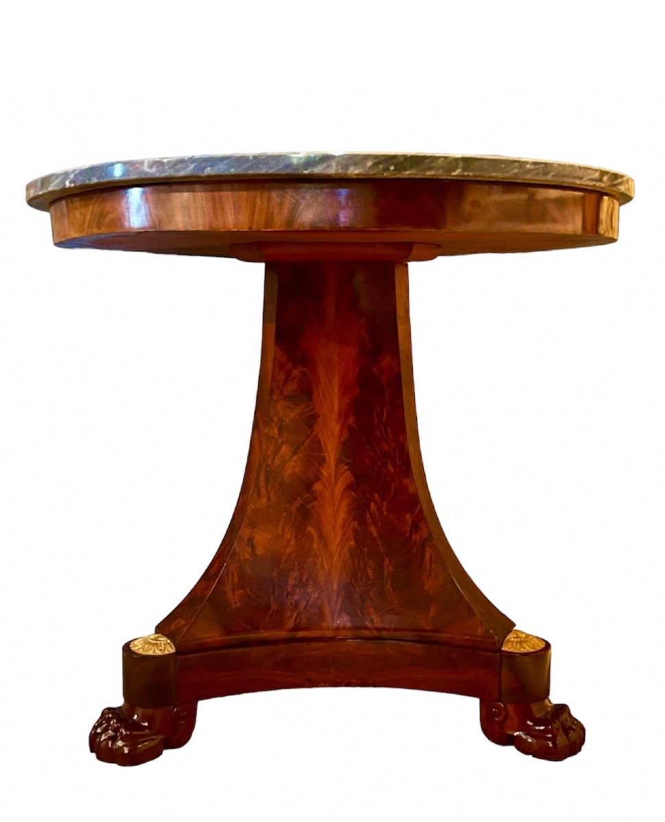 An Empire Period Round Mahogany And Mahogany Veneer Pedestal Table. Early 19th Century. 
