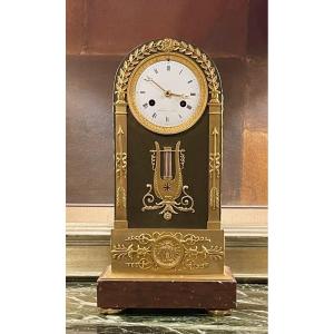 An Empire Gilt And Patinated Bronze Mantle Clock. Mesnil In Paris. 