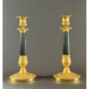 A Pair Of French Restoration Gilt And Patinated Bronze Candlesticks, Circa 1830.
