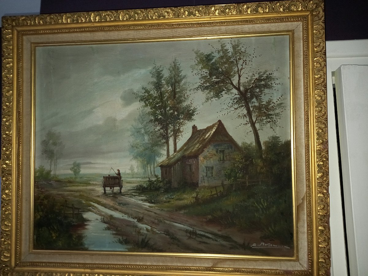 Huile sur toile, d'un paysage animé d'un homme sur sa charette , passant devant une maison.
