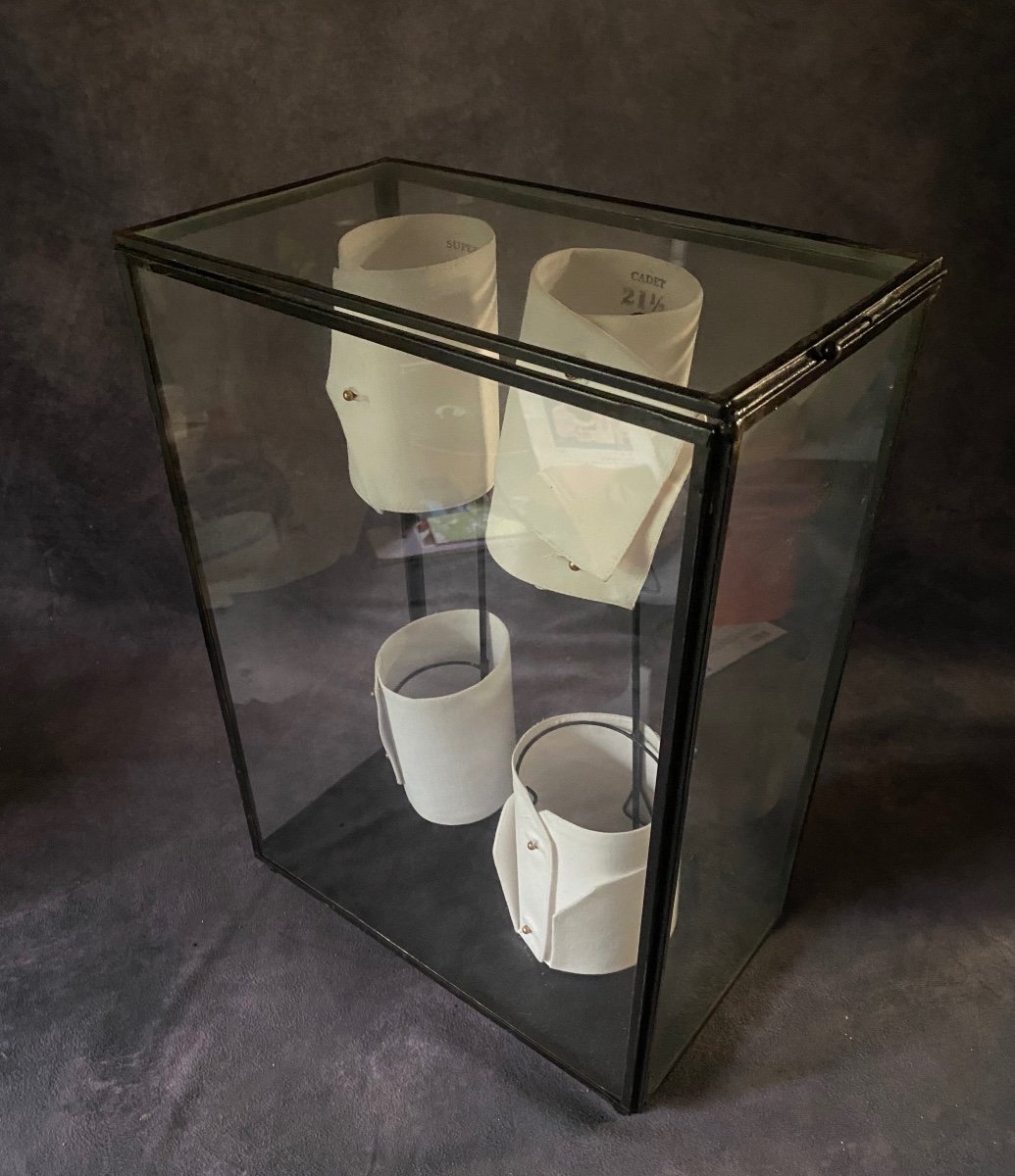 Old Glass And Iron Display Cabinet Containing A Series Of Shirt Cuffs.-photo-5