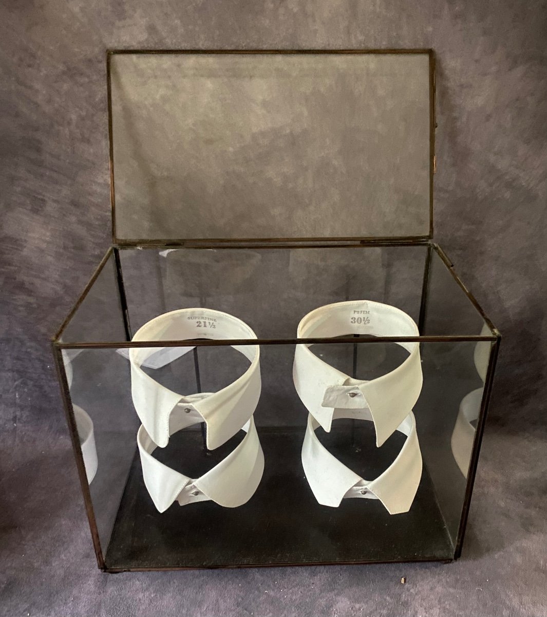 Vintage Glass And Iron Display Cabinet Containing A Series Of Shirt Collars.-photo-2