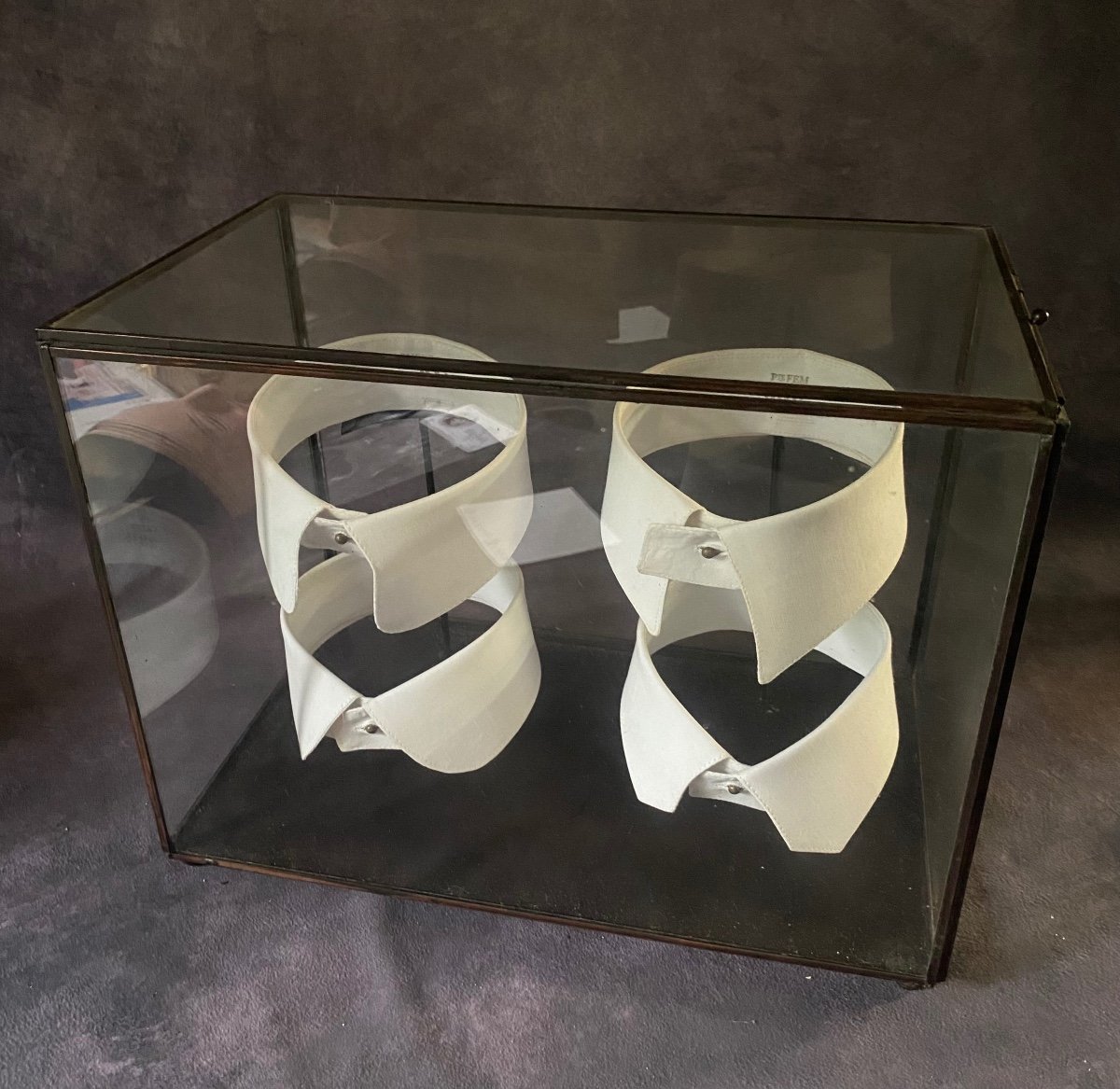 Vintage Glass And Iron Display Cabinet Containing A Series Of Shirt Collars.-photo-3