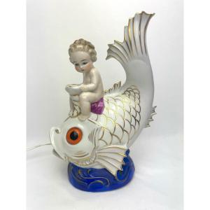 Veilleuse, Brulle Parfum En Porcelaine d'Un Enfant Monté Sur Un Poisson.