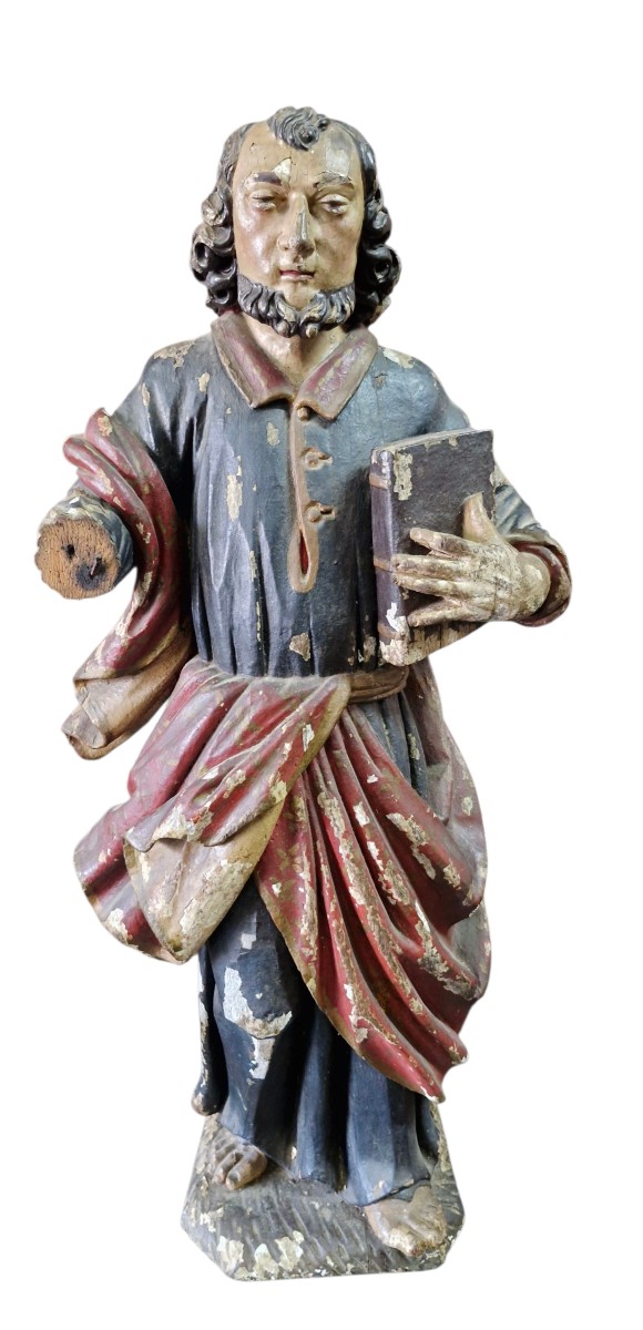 Statue Of A Saint With A Book
