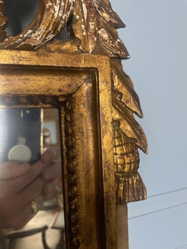 Miroir en bois doré et sculpté de style Louis XVI-photo-1