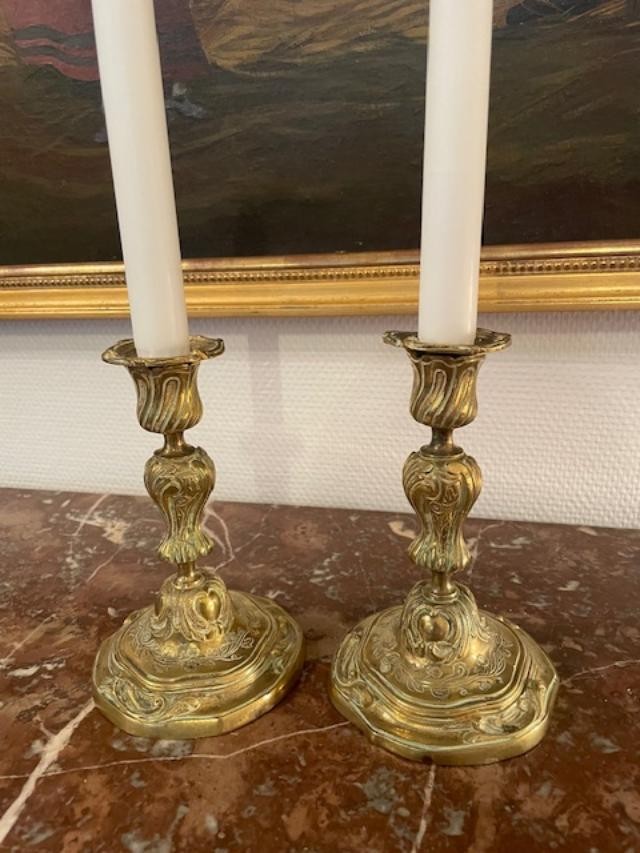 Pair Of Gilded And Chiseled Bronze Candlesticks