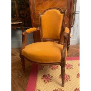 Fauteuil 18 ème en cabriolet en bois naturel d'époque Louis XVI