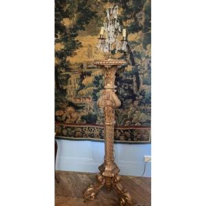 Porte torchère en bois sculpté et doré de style régence