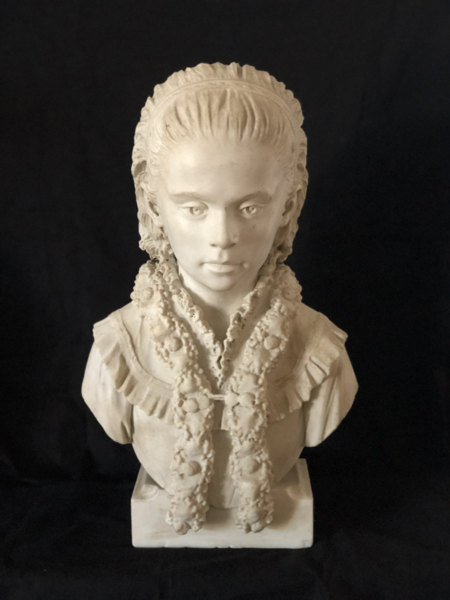 Bust Of Young Girl In White Marble