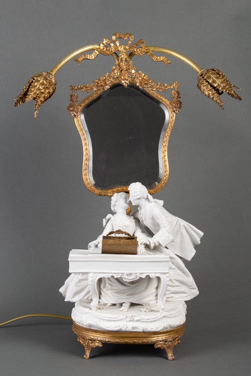 A Romantic Art Nouveau Biscuit And Gold Metal Lamp