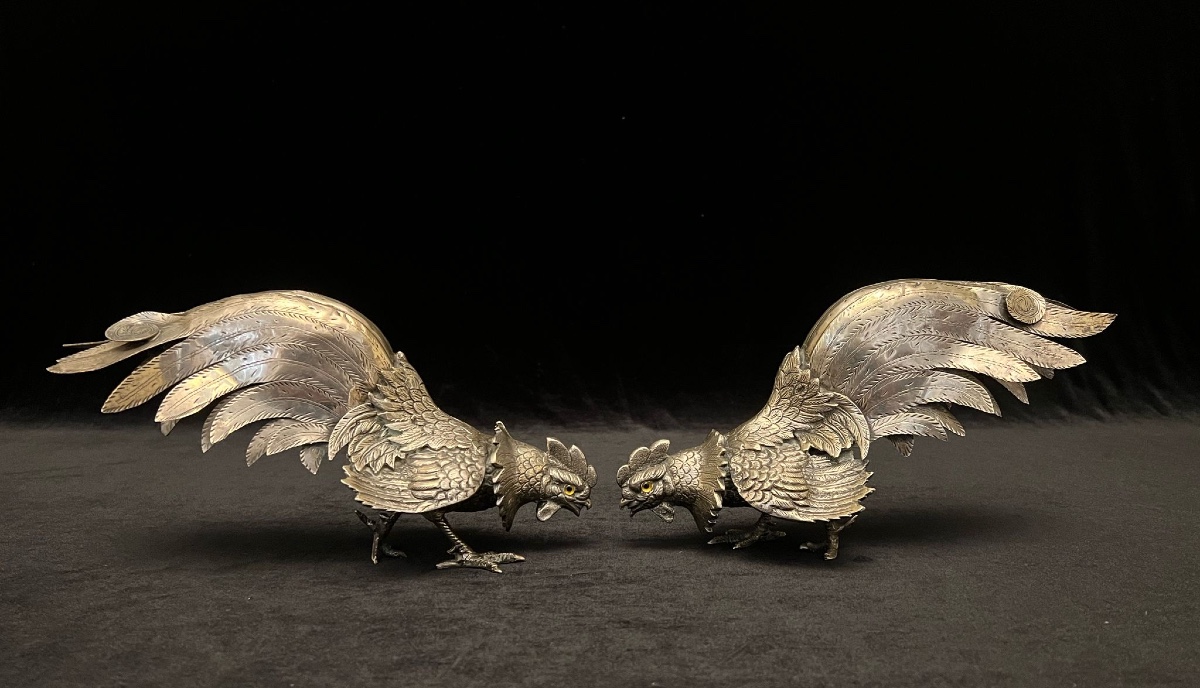 A Pair Of Silver Figures Of Battle Cocks