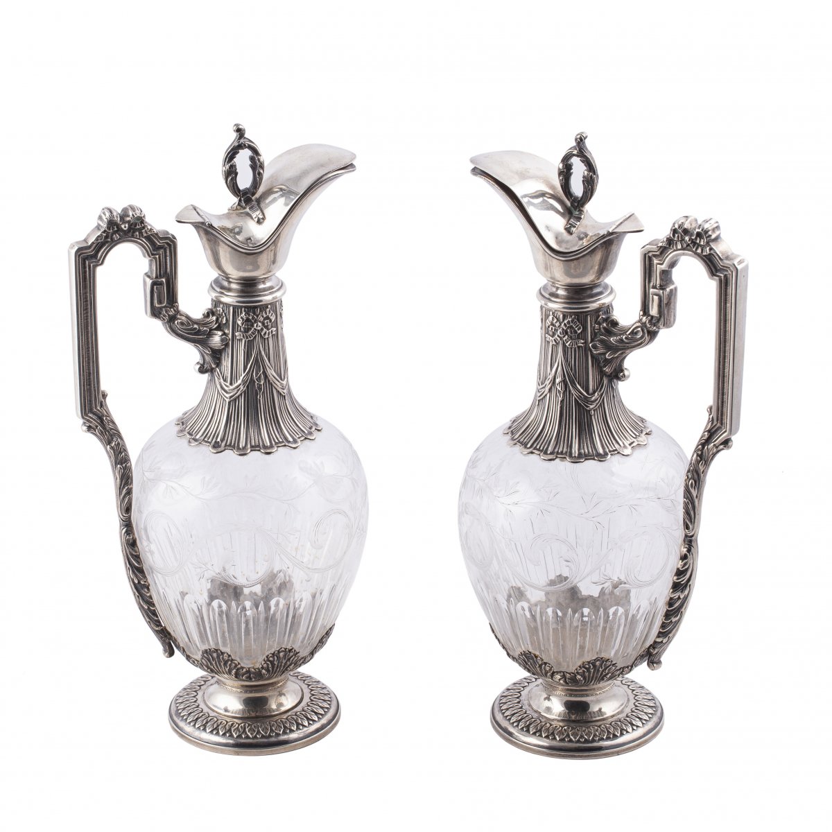 A Pair Of Silver And Cut Glass Claret Jugs