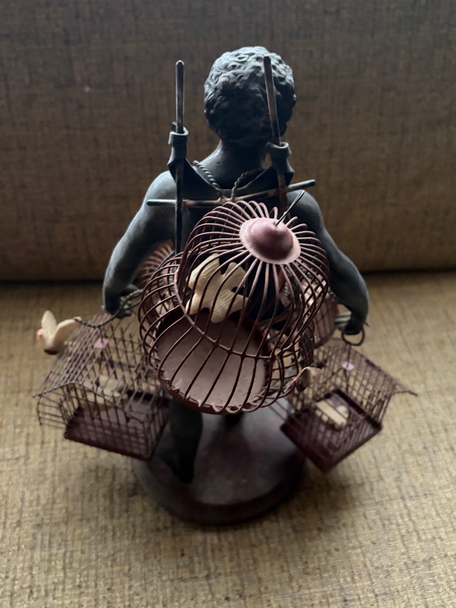  LE PORTEUR DE CAGES D'OISEAUX-photo-3