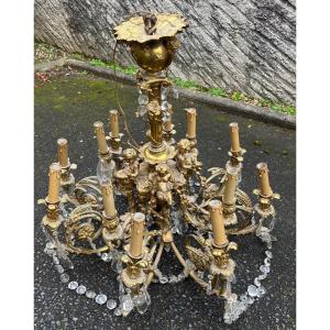 Lustre Bronze Avec 4 Putti Avec 3 Feux      12 Feux  