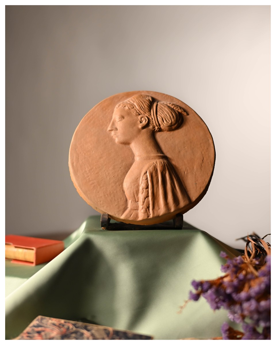 Pair Of Terracotta Medallions Depicting A Man And A Woman.